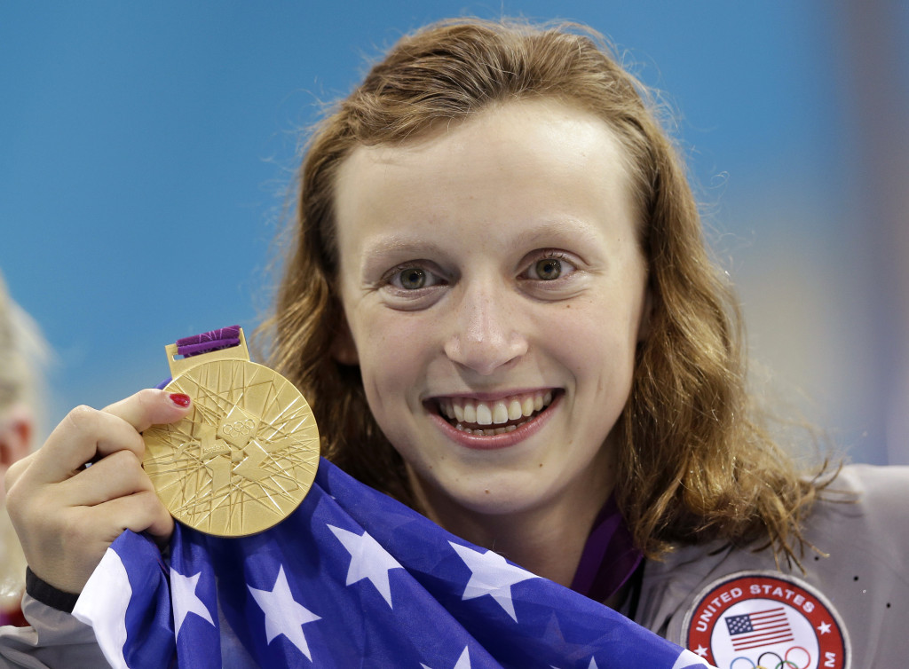 United States' Katie Ledecky holds up her gold medal after winning the women's 800-meter freestyle swimming final at the Aquatics Centre in the Olympic Park during the 2012 Summer Olympics in London, Friday, Aug. 3, 2012. (AP Photo/Lee Jin-man)