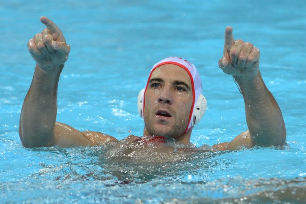 Aleksandar Ivovic of Montenegro celebrates after scoring a goal during the men's water polo bronze medal match Montenegro vs Serbia at the London 2012 Olympic Games in London on August 12, 2012. AFP PHOTO / ADEK BERRY