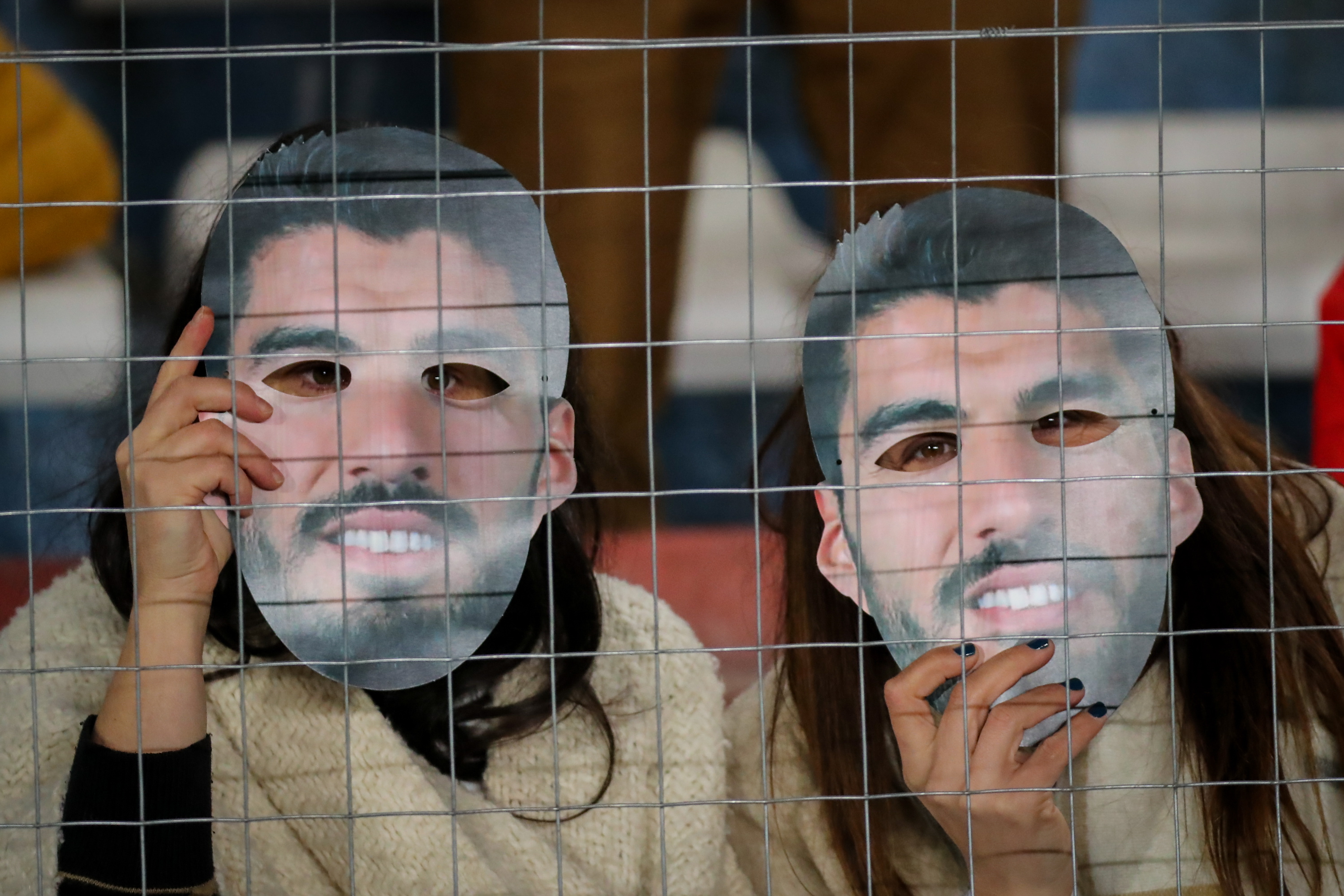 Nacional fans celebrated Luis Suarez's imminent return with face masks of the star